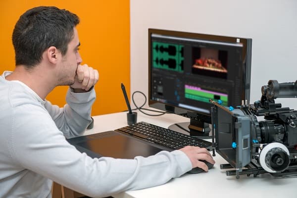 A person using video editing software to create videos