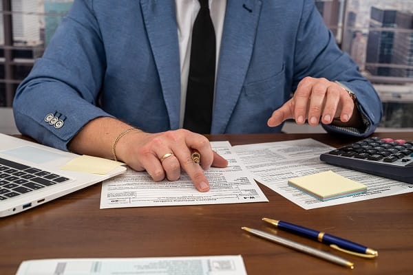 small business credit tax - man calculating tax credits