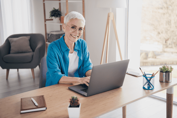 Older lady working of a laptop