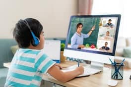 young man being tutored online